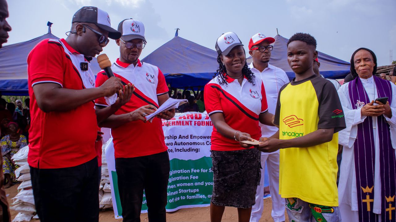 Foundation team at a community outreach event distributing support to beneficiaries